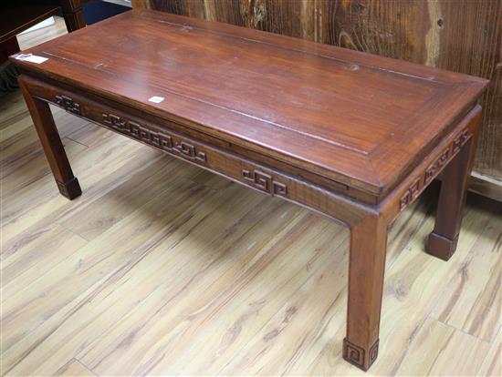 A Chinese hardwood low table, W.122cm